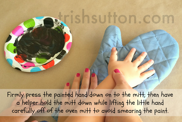 Firmly press the painted hand on oven mitt; TrishSutton.com