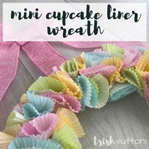 Create a Cupcake Liner Wreath with fun prints and seasonal shades. Colorful seasonal decor is made easy with this simple tutorial. TrishSutton.com