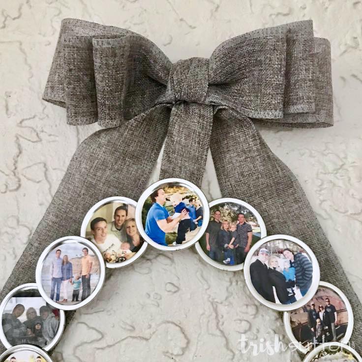 Create a DIY Photo Wreath using Mason jar lids and family photos. Share this sentimental circle of memories as a gift. Give it as a gift for birthdays, Mother's day, Grandparent's day or Christmas.