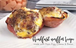 breakfast muffins made with eggs, bacon, ham & cheese on a white plate; overnight breakfast recipe