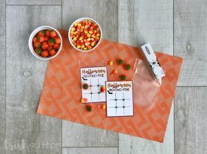 supplies to create Halloween party favors including free printable, candies, party bags & stapler