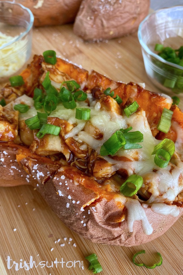 Sweet Potato filled with barbecue sauce covered chicken topped with cheese & green onions.