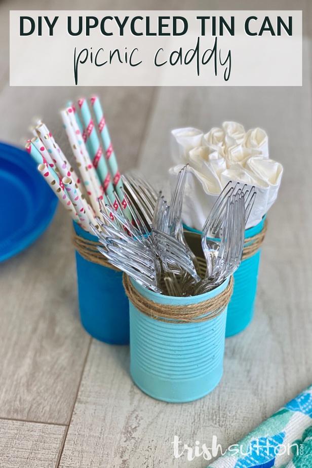 DIY caddy with forks, straws & napkins on a wood background.